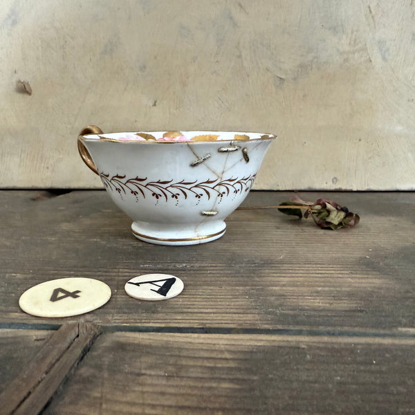 Pretty Staple Repair Antique Cup