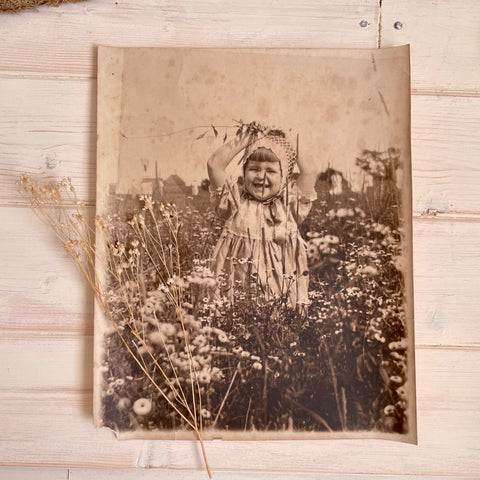 Vintage Photograph Child Playing in a Flower Field