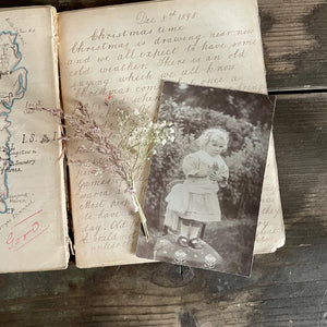 Vintage Postcard of a Child with Flower