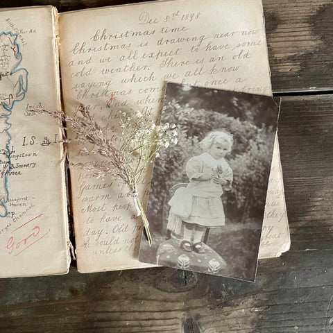 Vintage Postcard of a Child with Flower